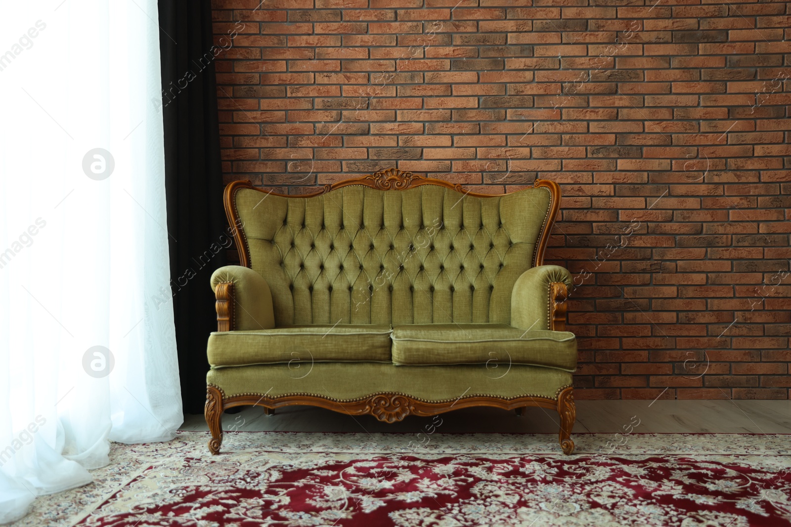 Green retro sofa in room. Interior design Photo of Green retro sofa in room. Interior design