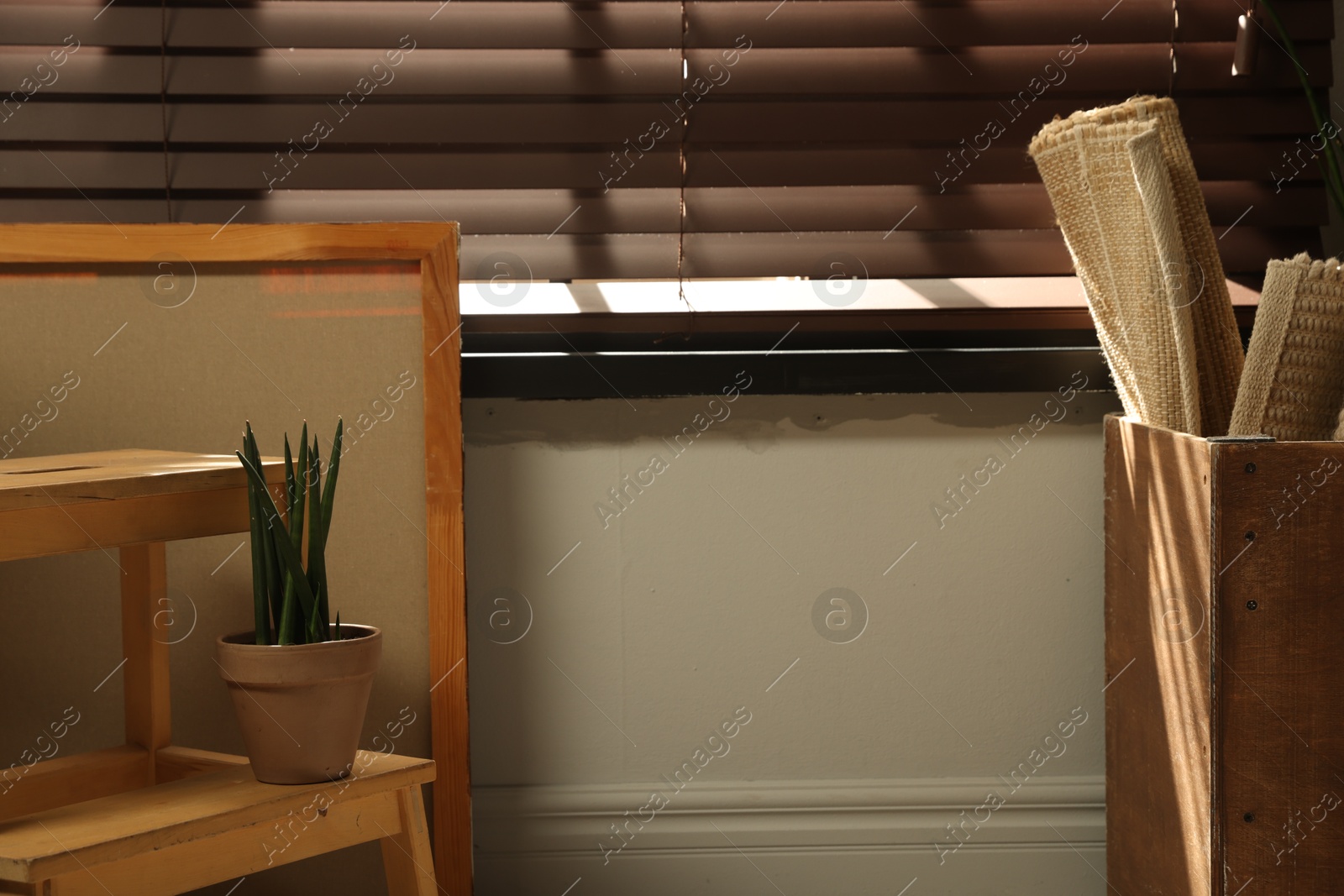 Photo of Many different used stuff near window indoors