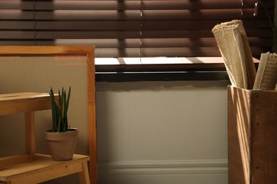 Photo of Many different used stuff near window indoors