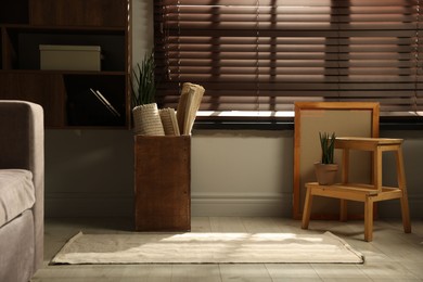 Photo of Many different used stuff near window indoors