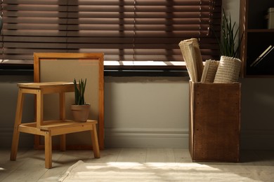 Photo of Many different used stuff near window indoors