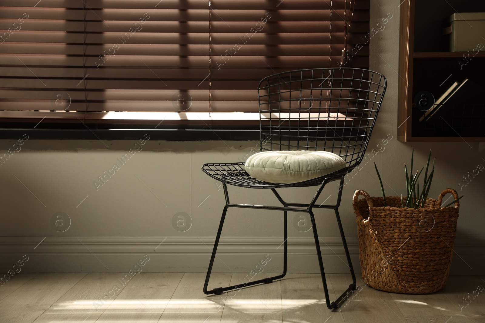 Photo of Stylish chair and other used stuff near window indoors, space for text