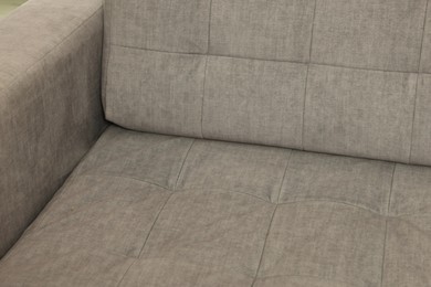 Photo of Soft sofa as background, closeup. Used stuff