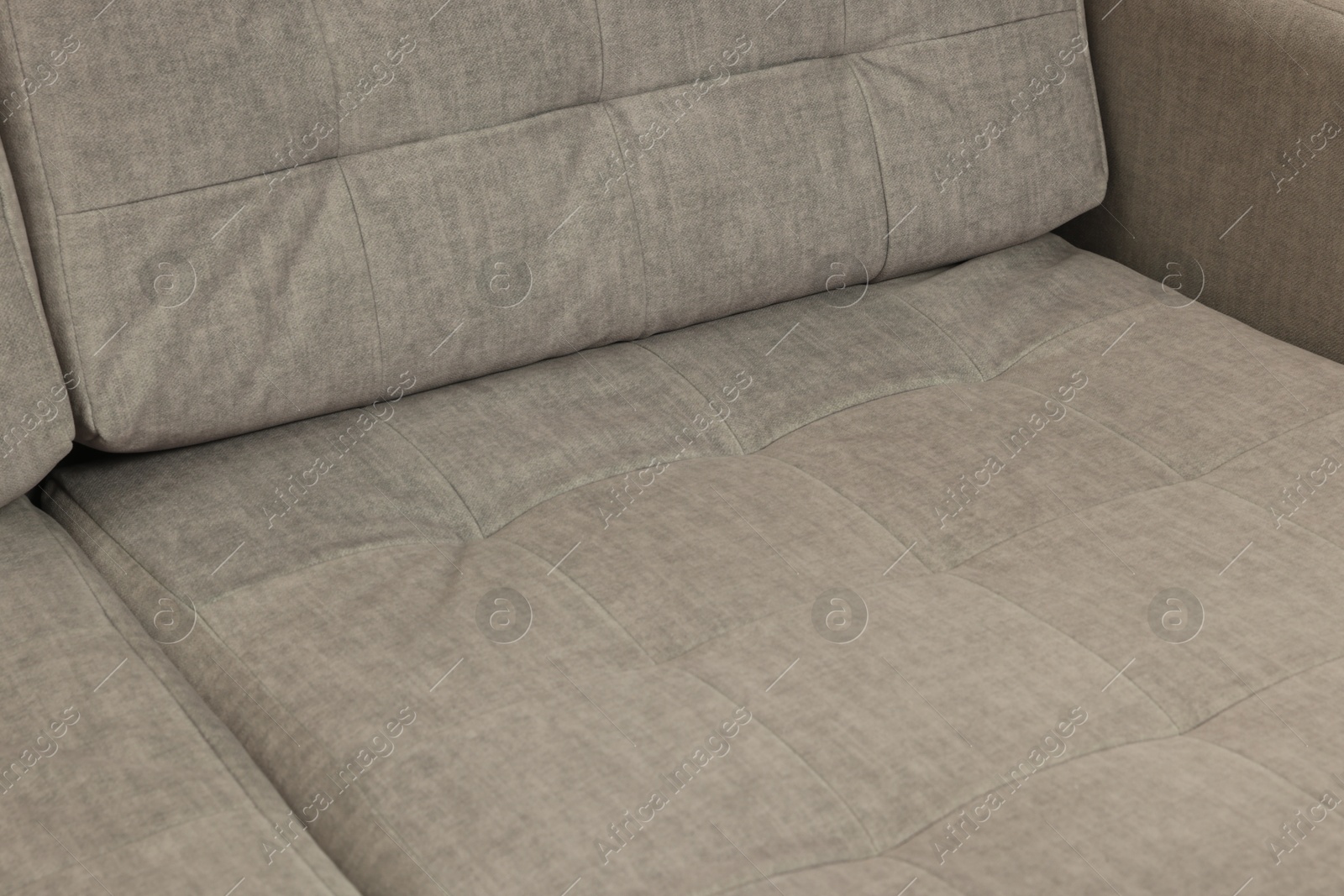 Photo of Soft sofa as background, closeup. Used stuff
