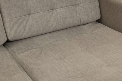 Photo of Soft sofa as background, closeup. Used stuff
