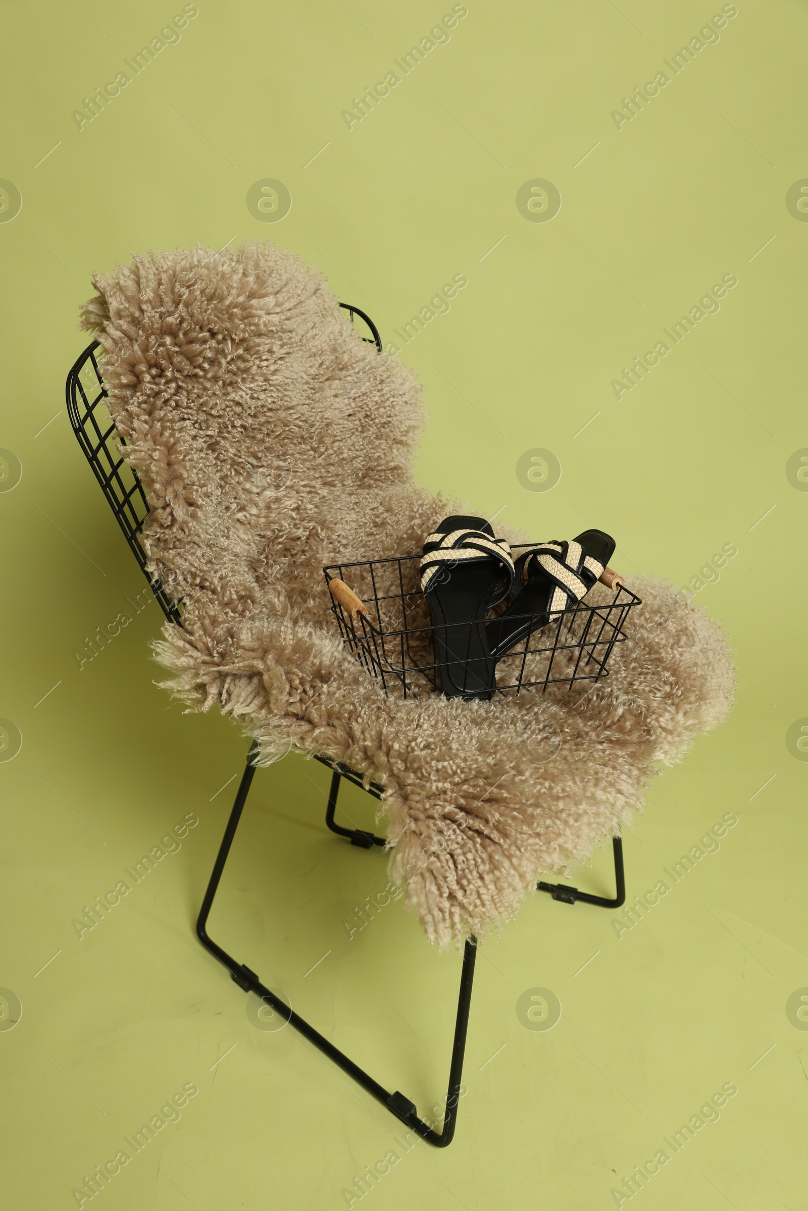 Photo of Bar stool, chair and shoes on olive background. Used stuff