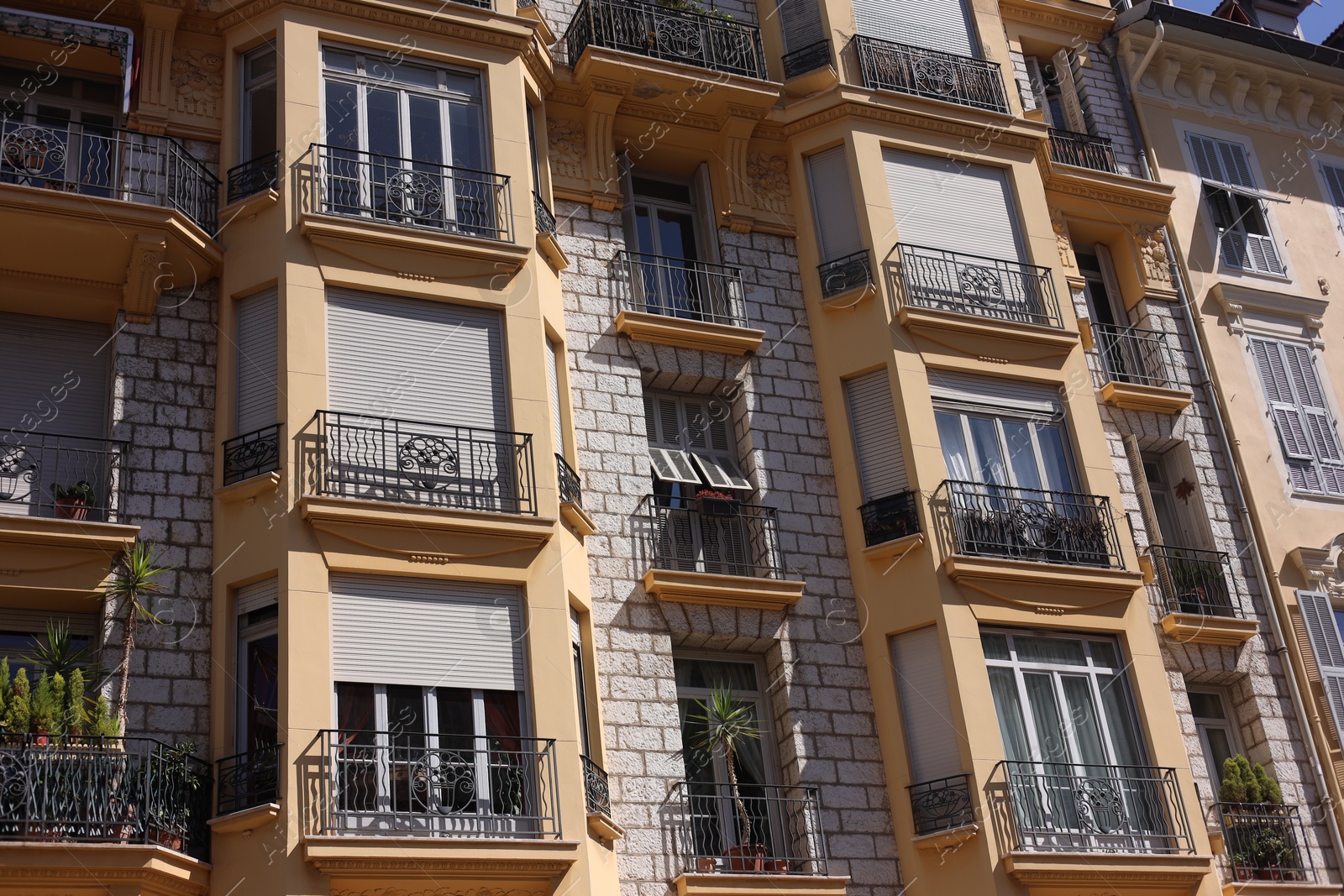 Nice, France - August 23, 2025: Beautiful building with windows and balconies in city Photo of Nice, France - August 23, 2025: Beautiful building with windows and balconies in city