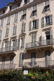 Photo of Nice, France - August 23, 2025: Beautiful building with windows and balconies in city