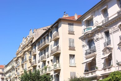 Photo of Nice, France - August 23, 2025: Beautiful building with windows and balconies against blue sky in city