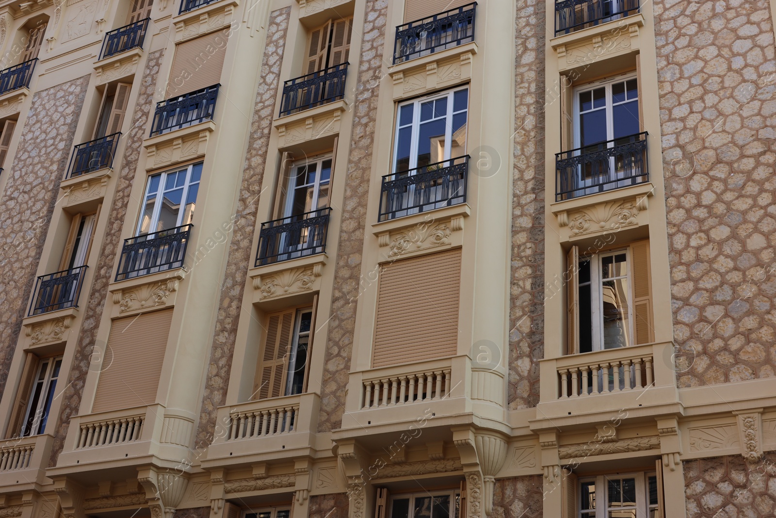 Photo of Nice, France - August 23, 2025: Beautiful building with windows and balconies in city