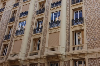 Photo of Nice, France - August 23, 2025: Beautiful building with windows and balconies in city