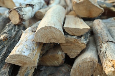Photo of Pile of cut firewood outdoors, closeup view