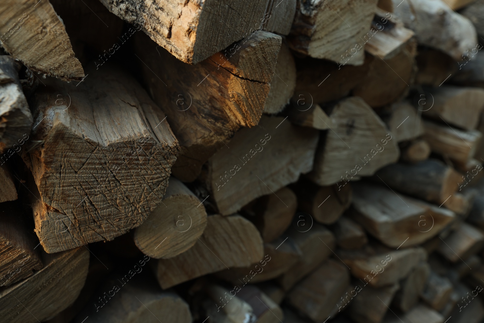 Photo of Pile of cut firewood outdoors, closeup view
