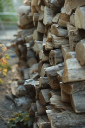 Photo of Pile of cut firewood outdoors, closeup view