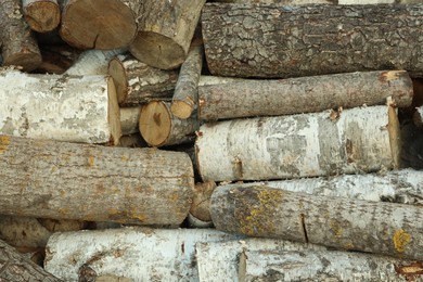 Photo of Pile of cut firewood outdoors, closeup view
