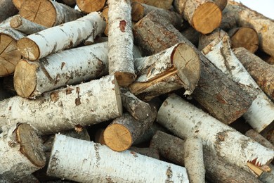 Photo of Pile of cut firewood outdoors, closeup view