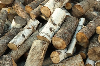 Photo of Pile of cut firewood outdoors, closeup view