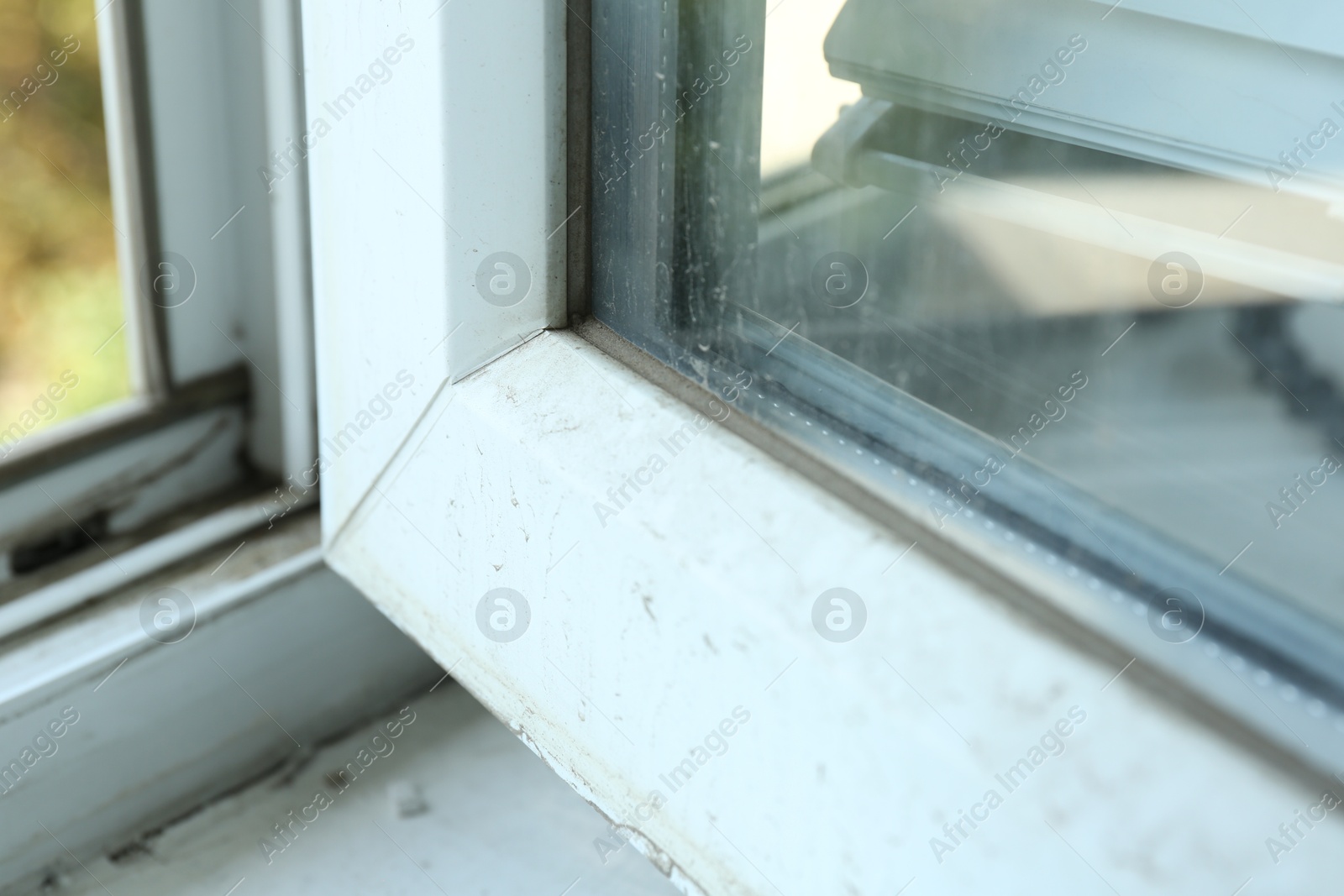 Photo of Window frame covered with dust indoors, closeup