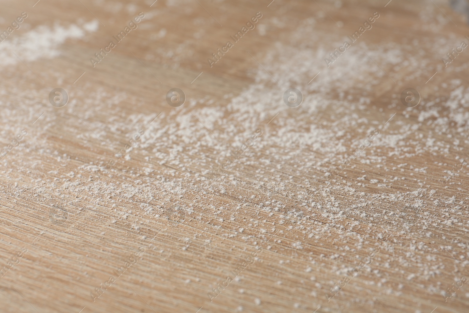 Photo of Wooden table covered with dust, closeup view