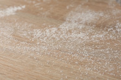 Photo of Wooden table covered with dust, closeup view