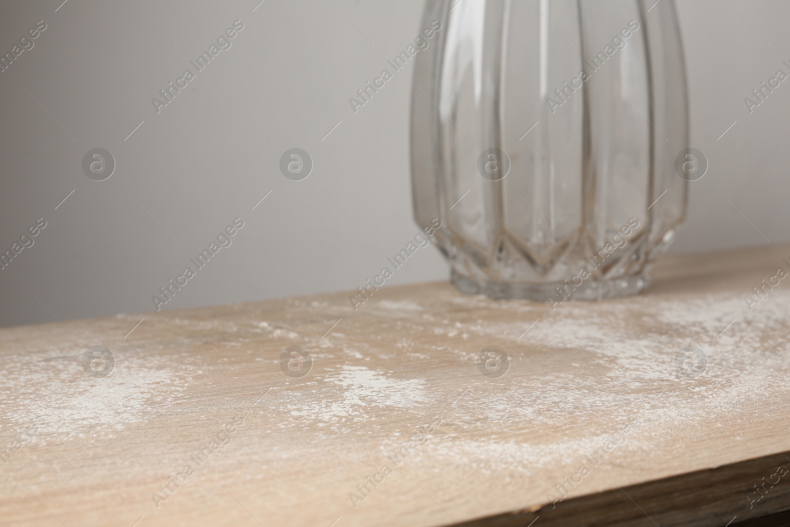Wooden table covered with dust indoors, closeup Photo of Wooden table covered with dust indoors, closeup
