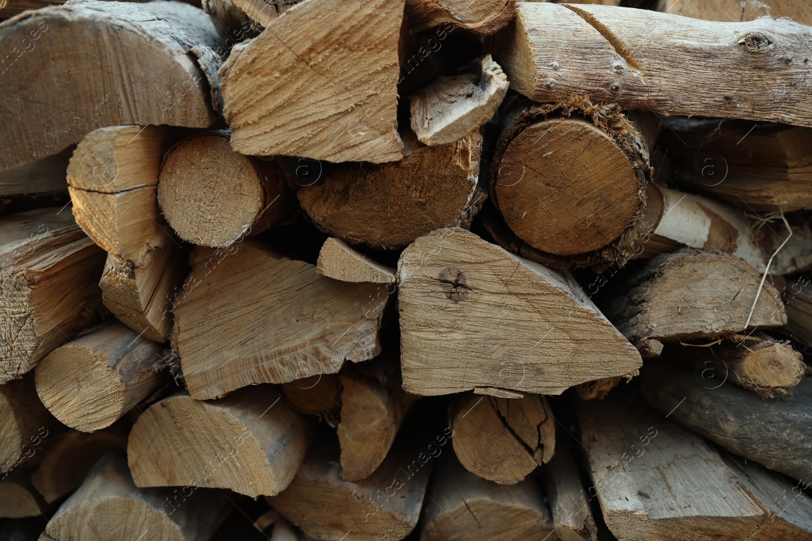 Pile of cut firewood outdoors, closeup view Photo of Pile of cut firewood outdoors, closeup view