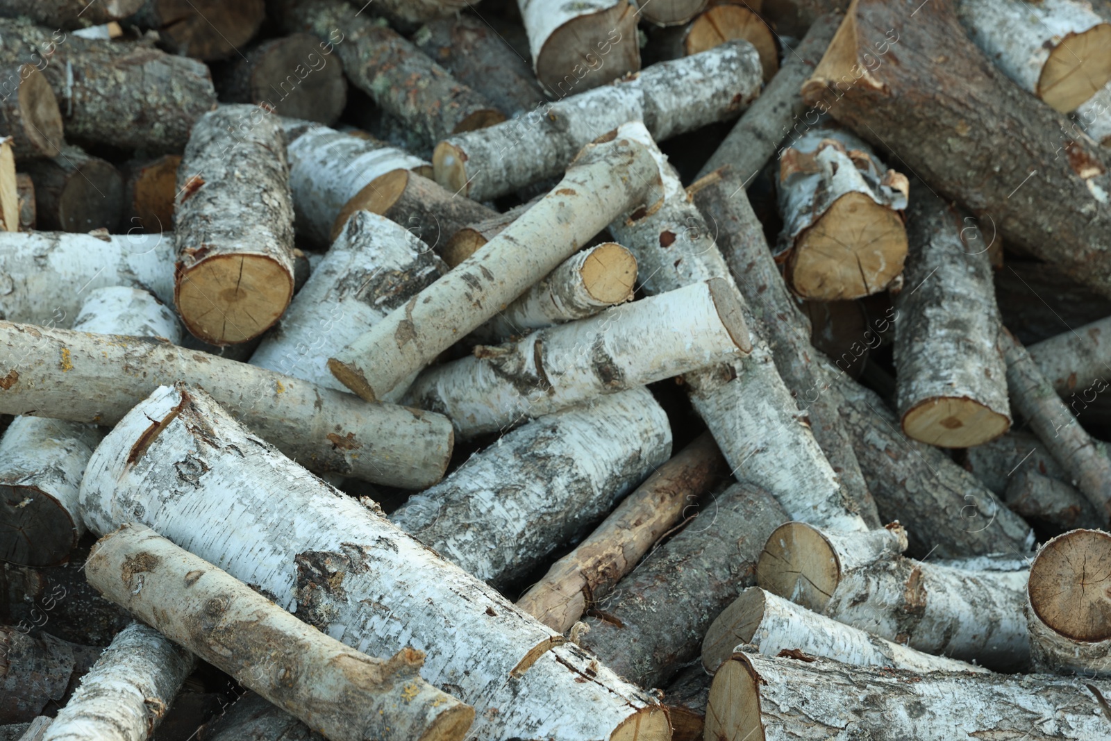 Pile of cut firewood outdoors, closeup view Photo of Pile of cut firewood outdoors, closeup view