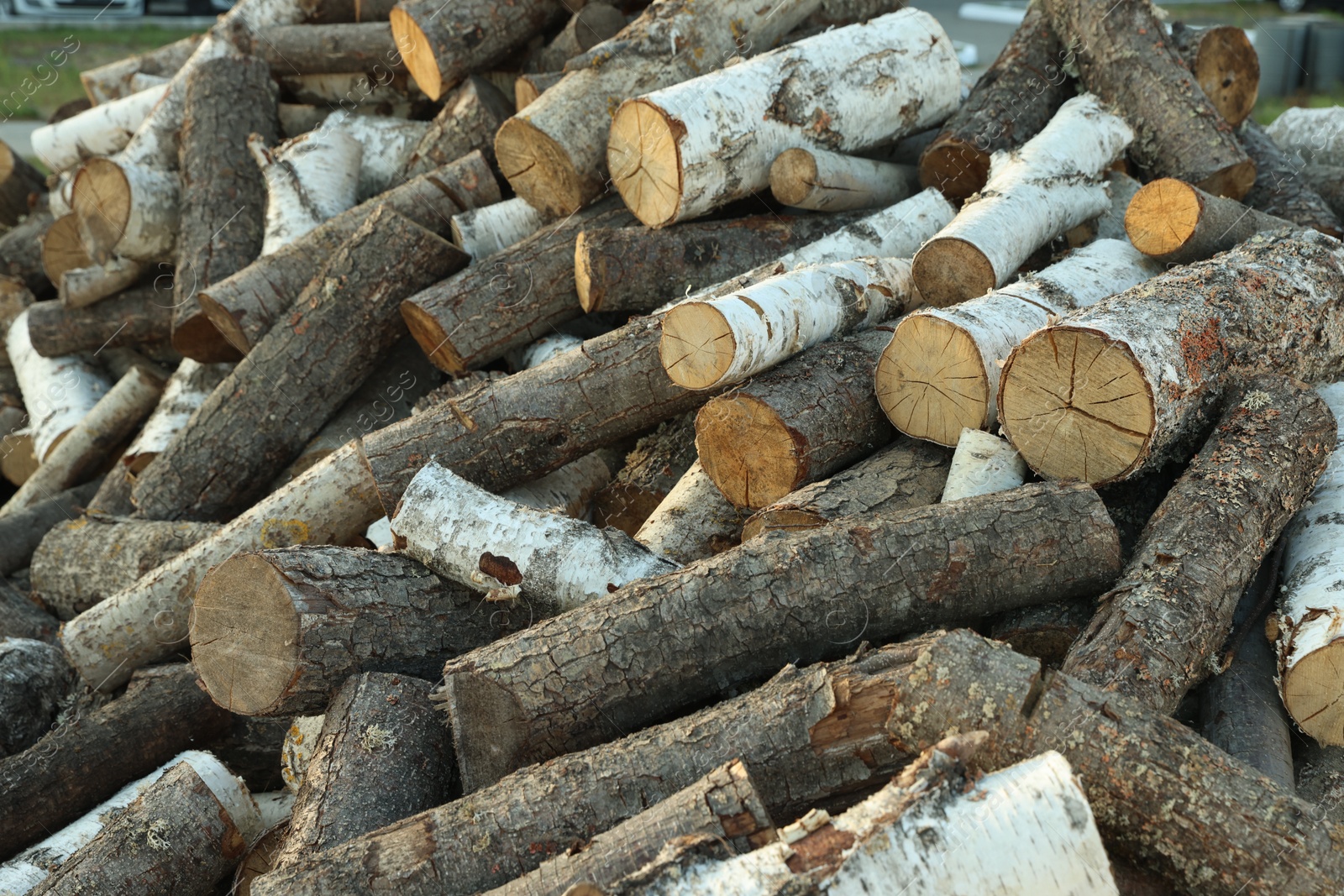 Pile of cut firewood outdoors, closeup view Photo of Pile of cut firewood outdoors, closeup view
