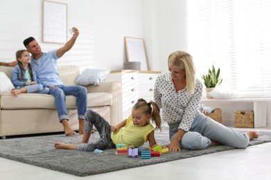 Photo of Happy family spending time together at home
