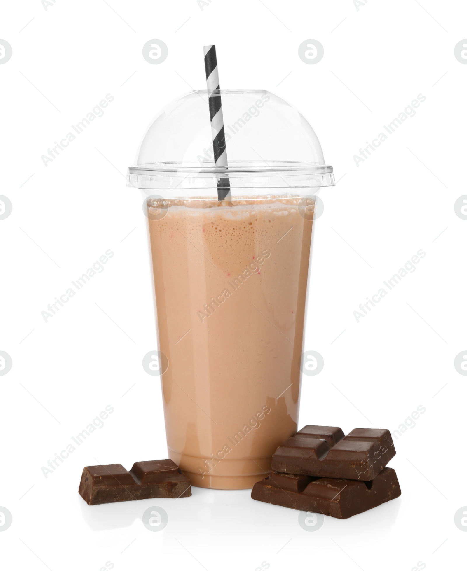 Photo of Tasty milkshake in plastic cup and chocolate pieces isolated on white
