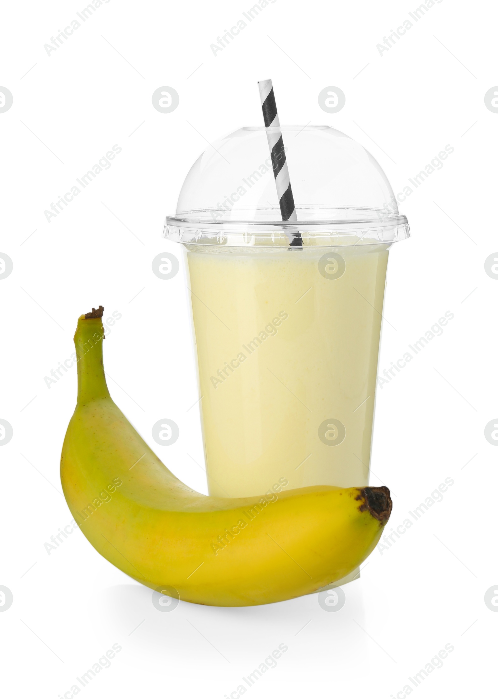Photo of Tasty banana milkshake in plastic cup and fresh fruit isolated on white