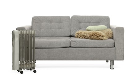 Photo of Soft sofa, electric heater and other used stuff isolated on white