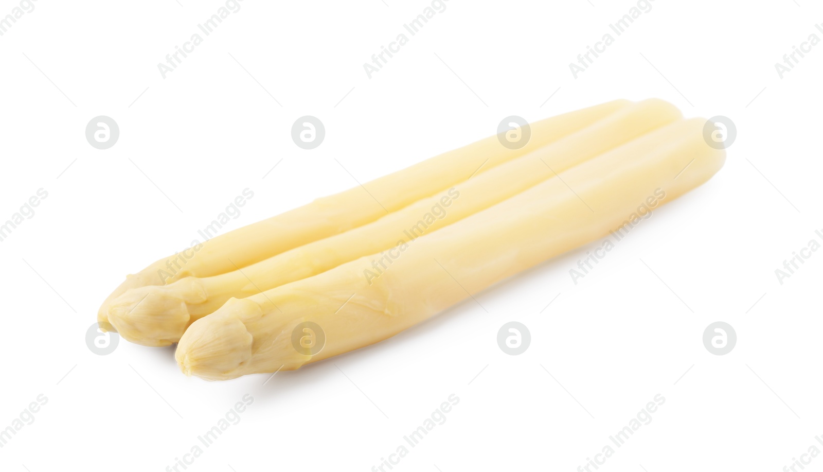 Photo of Spears of pickled asparagus isolated on white