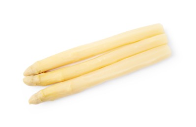 Photo of Spears of pickled asparagus isolated on white, top view