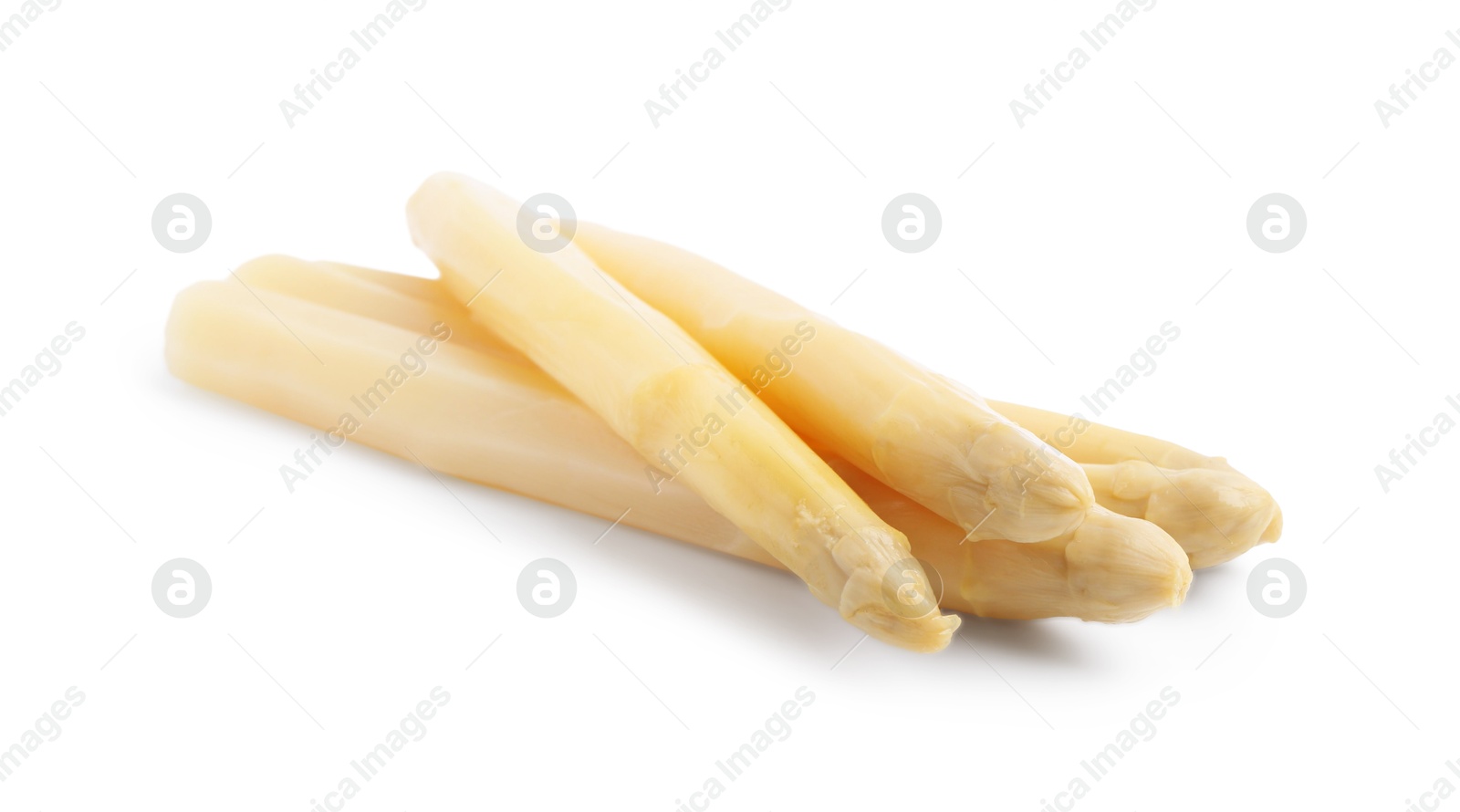 Spears of pickled asparagus isolated on white Photo of Spears of pickled asparagus isolated on white