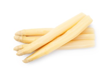 Photo of Spears of pickled asparagus isolated on white, top view
