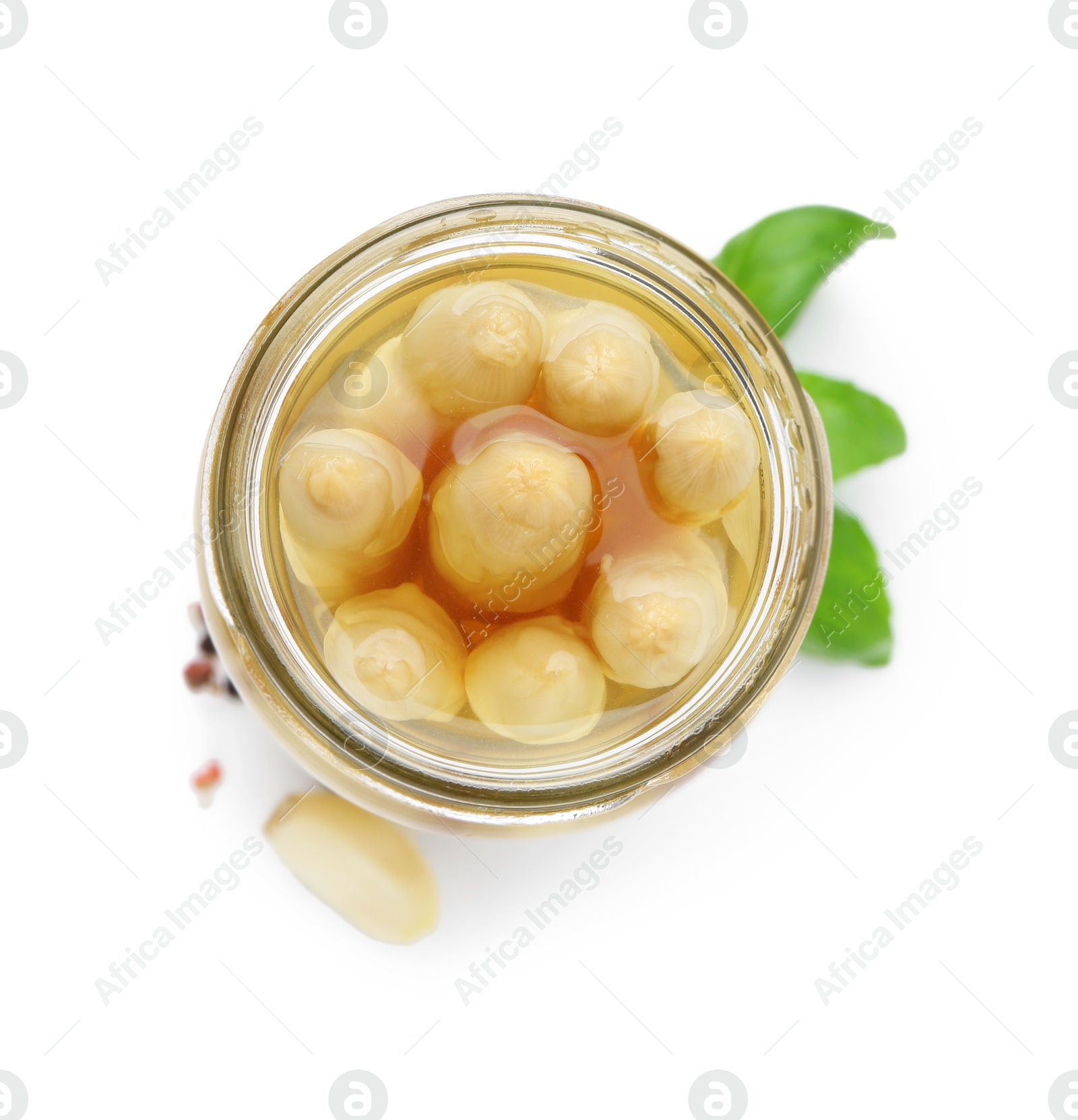 Photo of Pickled asparagus in jar and spices isolated on white, top view