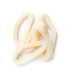 Photo of Many uncooked squid rings isolated on white, top view