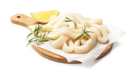 Photo of Uncooked squid rings with lemon slice and rosemary isolated on white