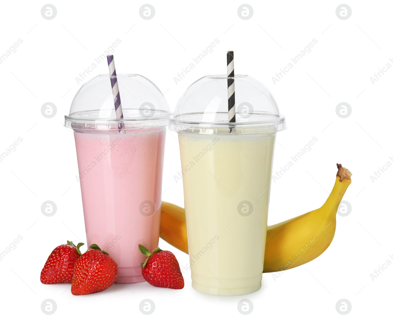 Photo of Milkshakes of different flavors in plastic cups and ingredients isolated on white