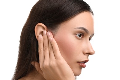 Photo of Sound. Woman touching her ear on white background, closeup