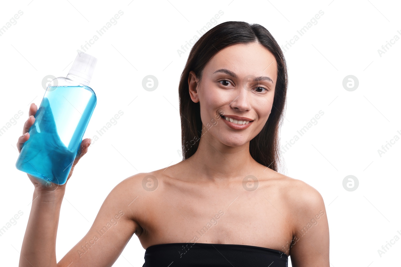 Photo of Smiling young woman with bottle of mouthwash on white background. Oral hygiene