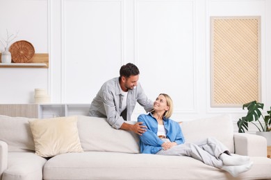 Photo of Happy couple spending time together at home