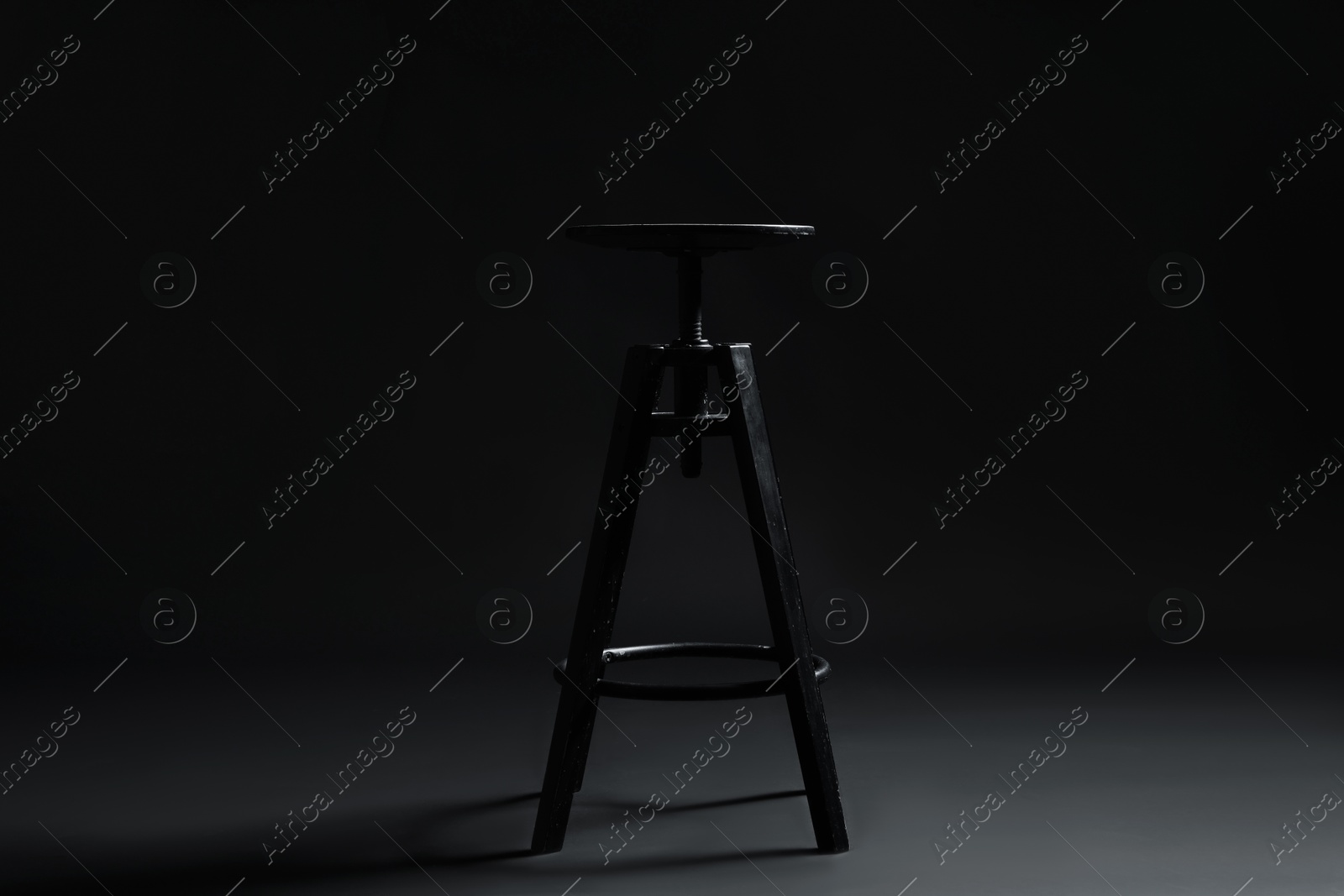 Bar stool on black background. Used stuff Photo of Bar stool on black background. Used stuff