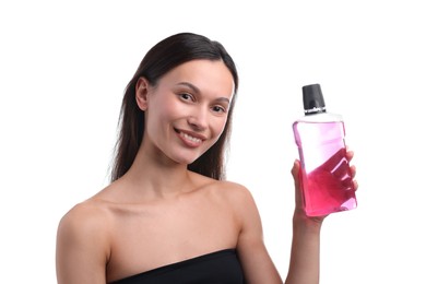 Photo of Smiling young woman with bottle of mouthwash on white background. Oral hygiene