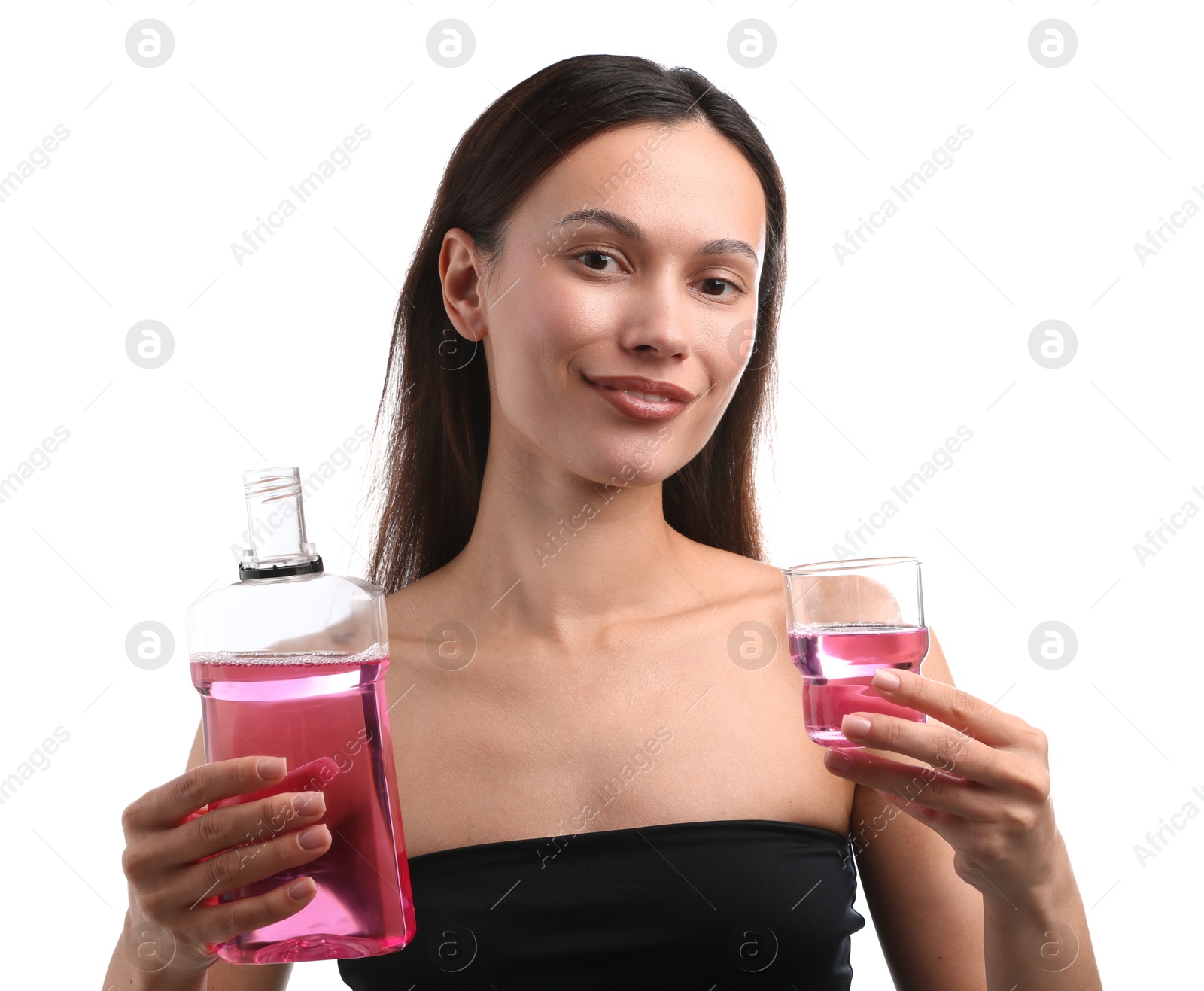 Photo of Smiling young woman with mouthwash isolated on white. Oral hygiene