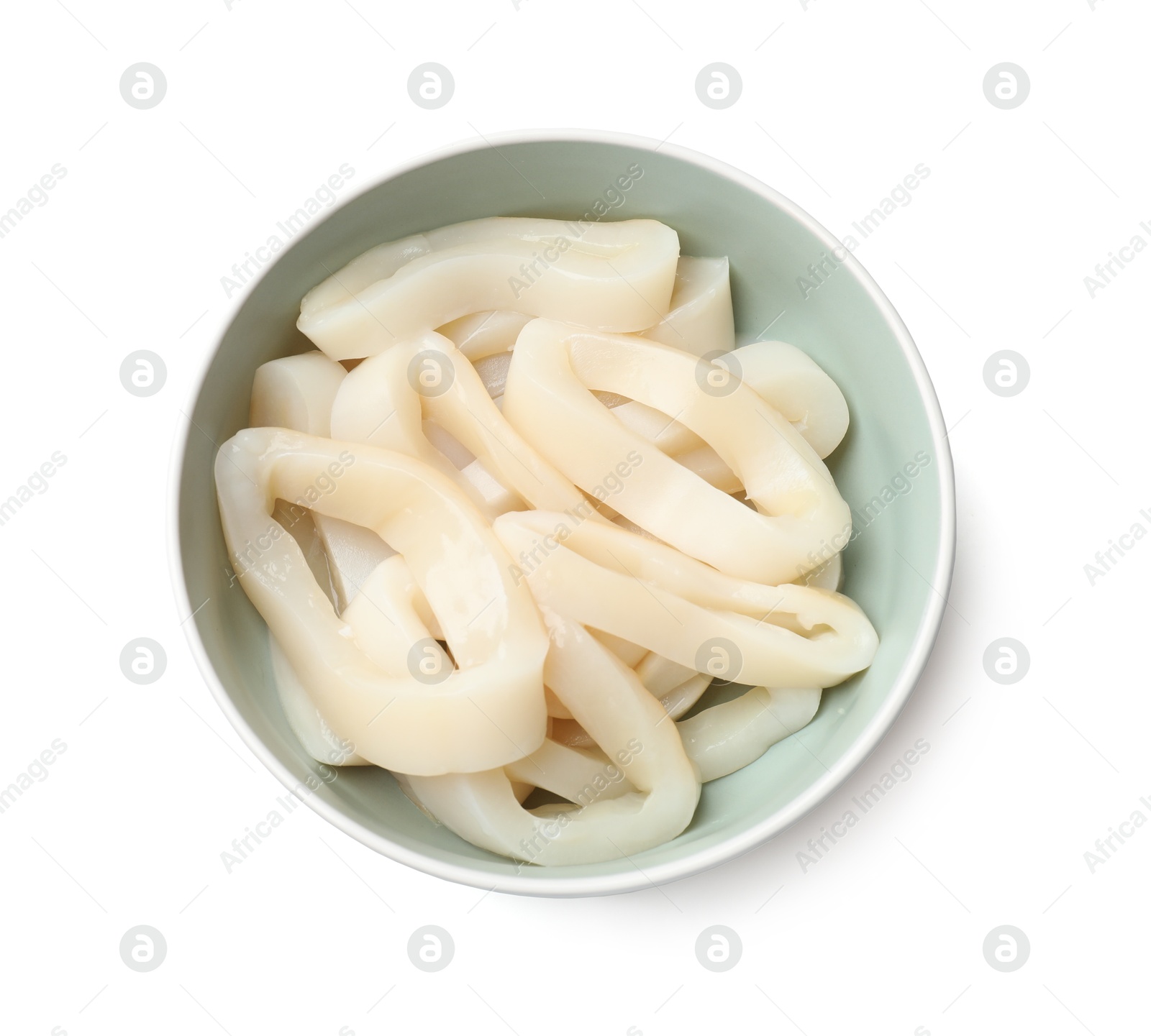 Photo of Uncooked squid rings in bowl isolated on white, top view