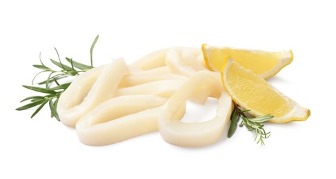 Photo of Uncooked squid rings with lemon slices and rosemary isolated on white