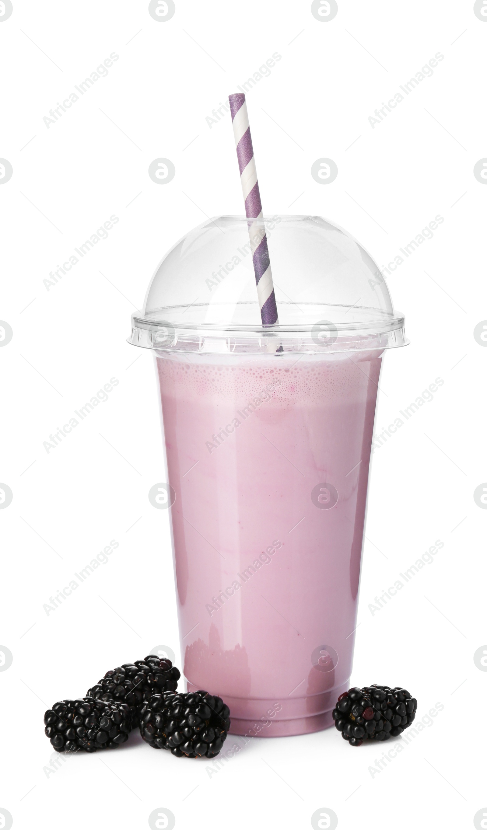 Photo of Tasty blackberry milkshake in plastic cup and fresh berries isolated on white