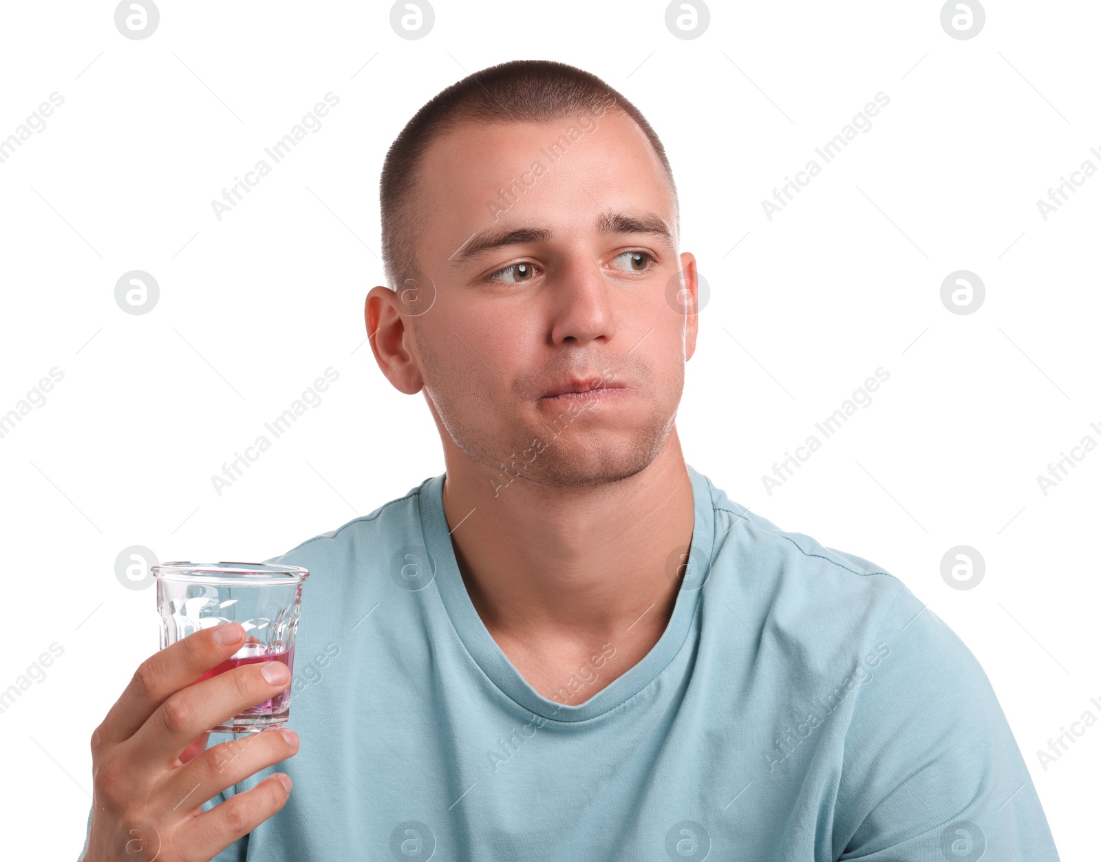 Photo of Man rinsing mouth with mouthwash on white background